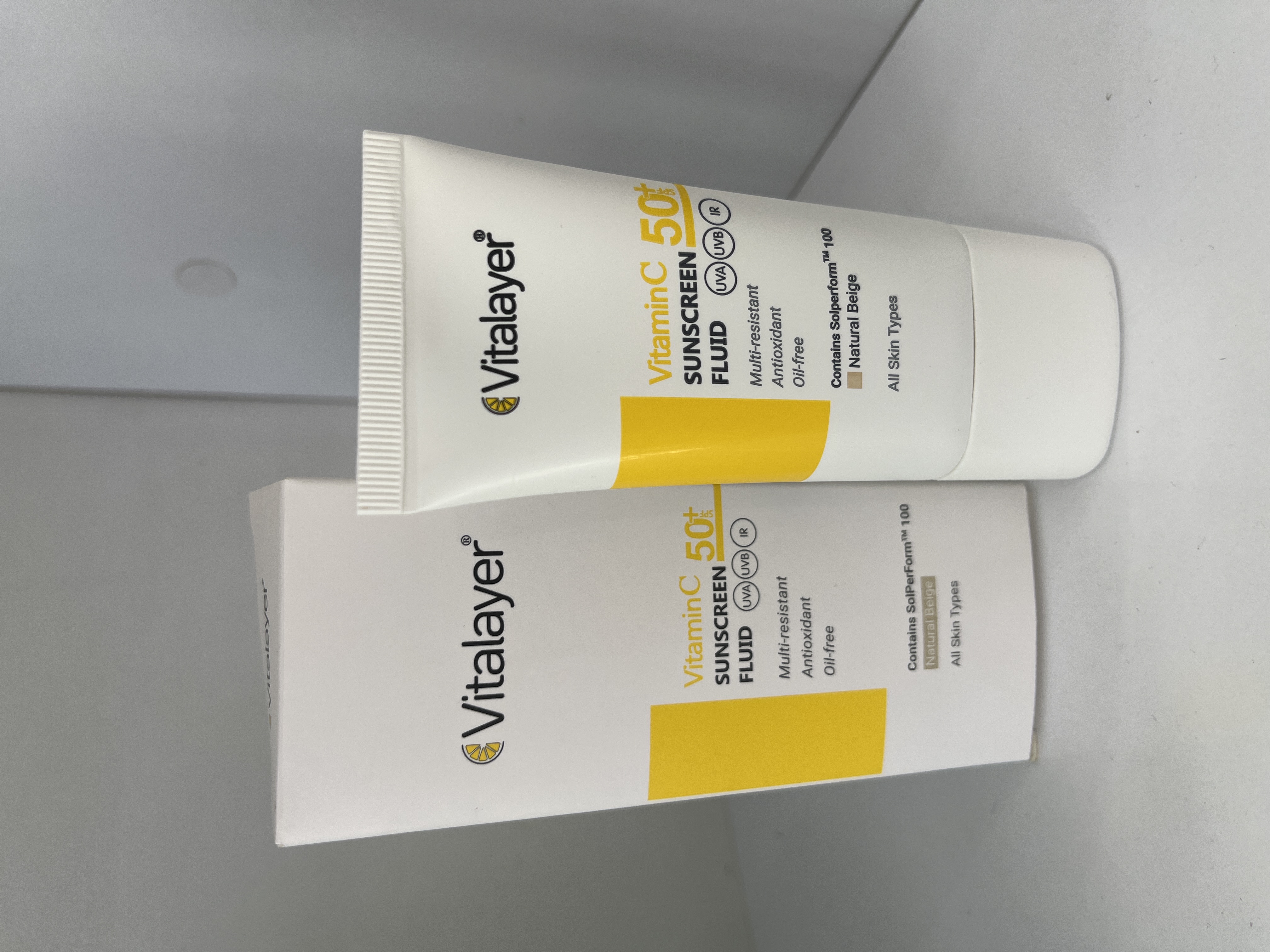 فلوئید ضد آفتاب ویتالایر مدل ویتامین SPF50 نچرال بژ 50 میل